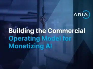 Professional collaborating at a whiteboard with charts, representing the cross-functional commercial operating model required to monetize AI.